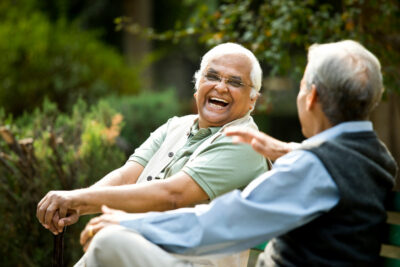 Two old men talking in the park